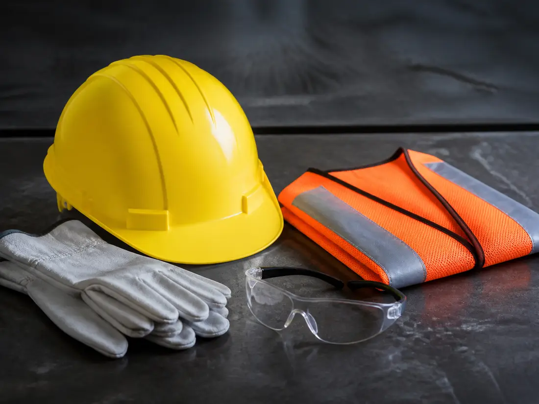 Hard hat, gloves, safety glasses and reflective vest